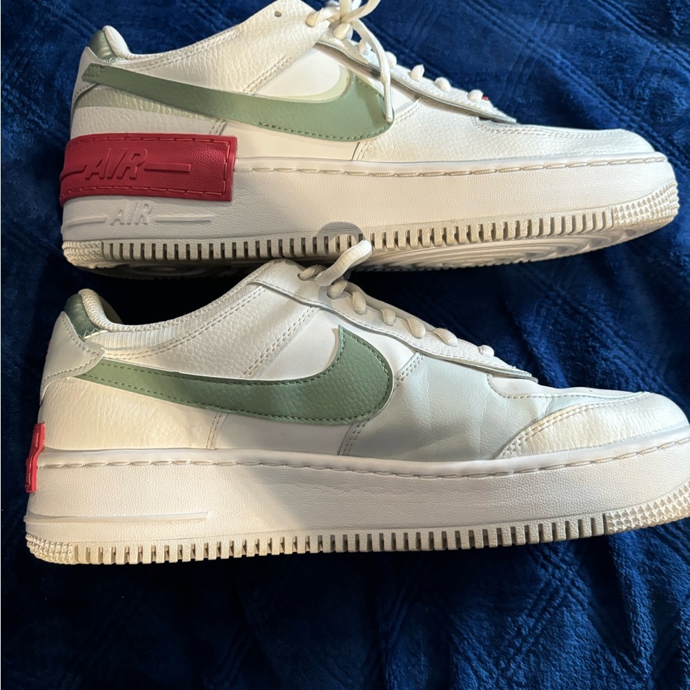 Size 11 Nike Air Force One. white base, sage green swoosh and red heel and more